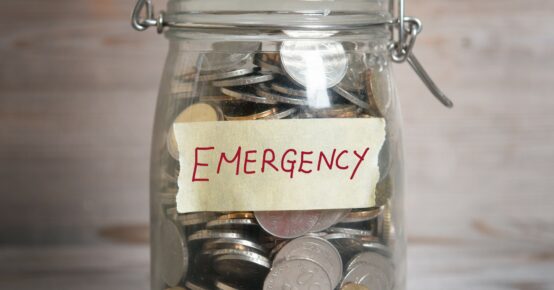 Money jar with emergency label.