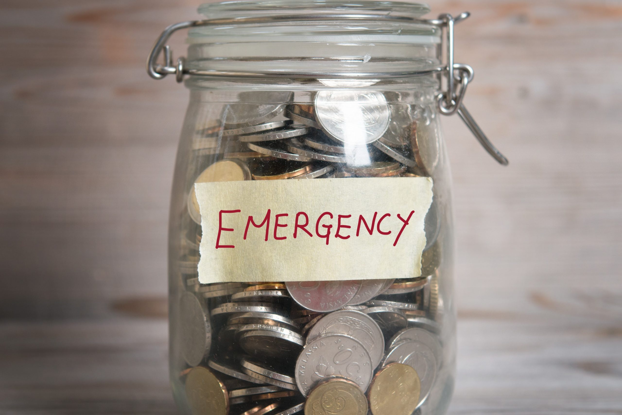Money jar with emergency label.