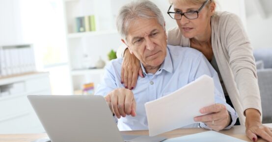 Senior couple doing the income tax declaration online